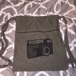 Drawstring bag has a camera on it